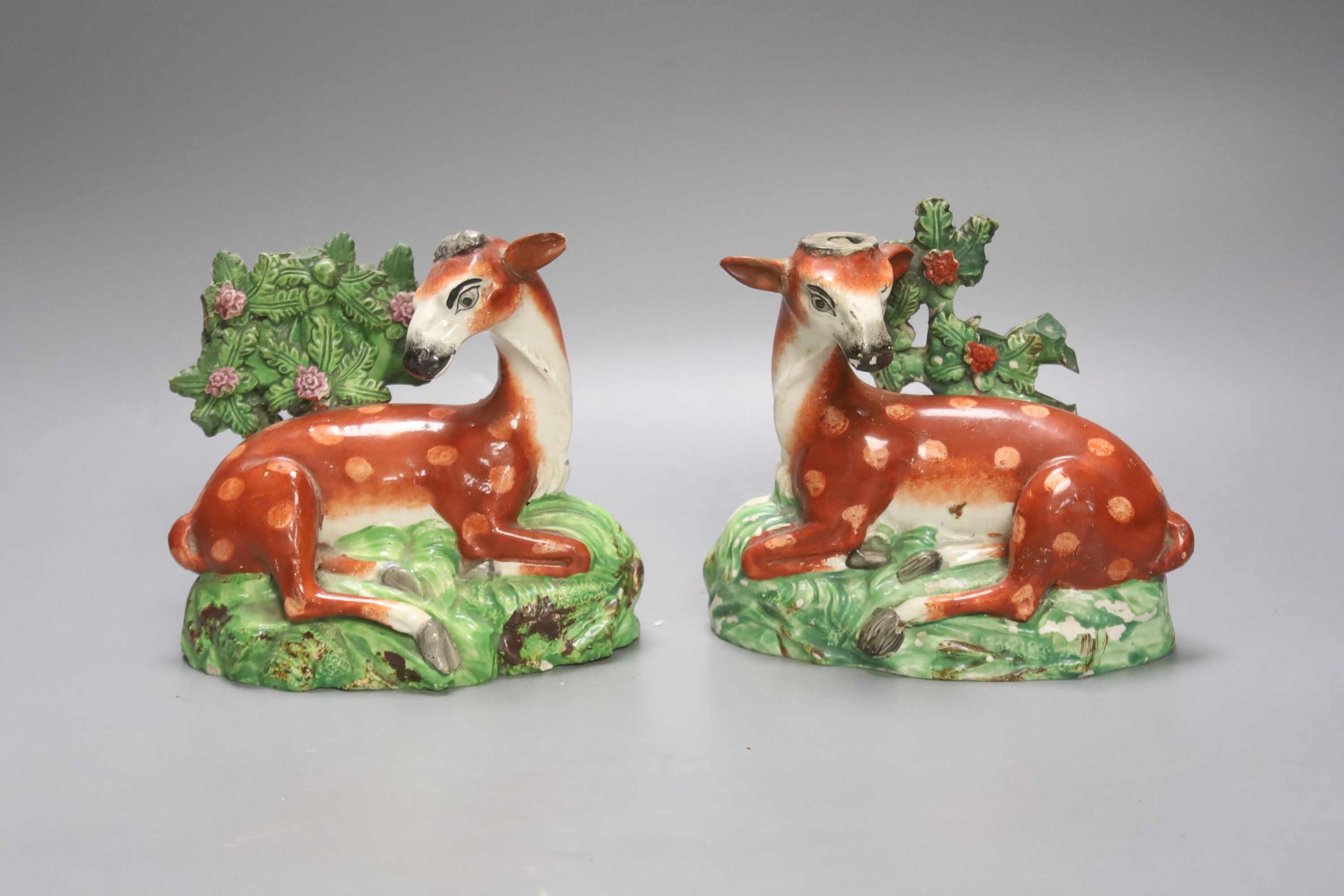 A pair of early 19th century Staffordshire models of deer